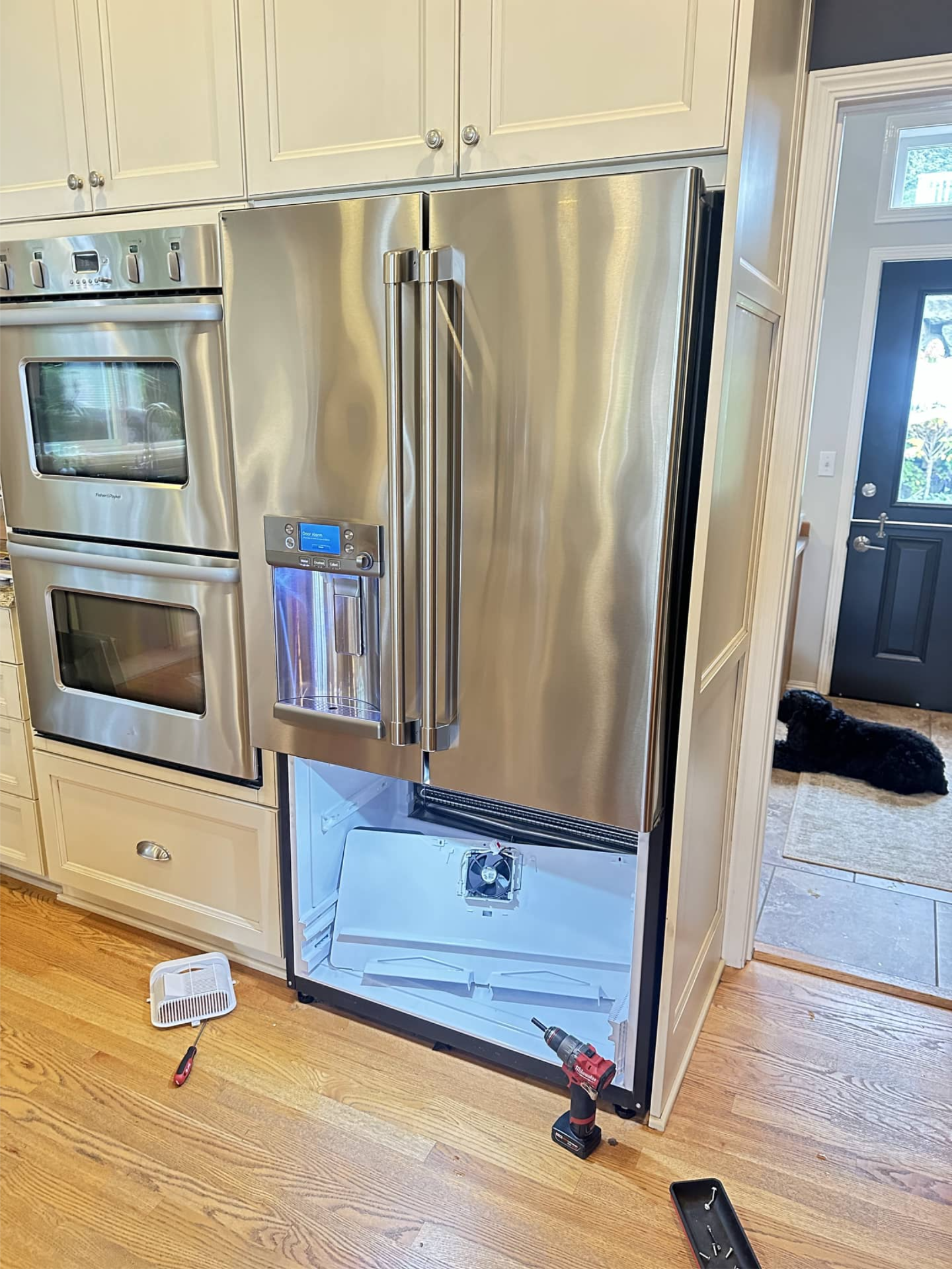 GE refrigerator not cooling repair in progress with rear freezer panel removed