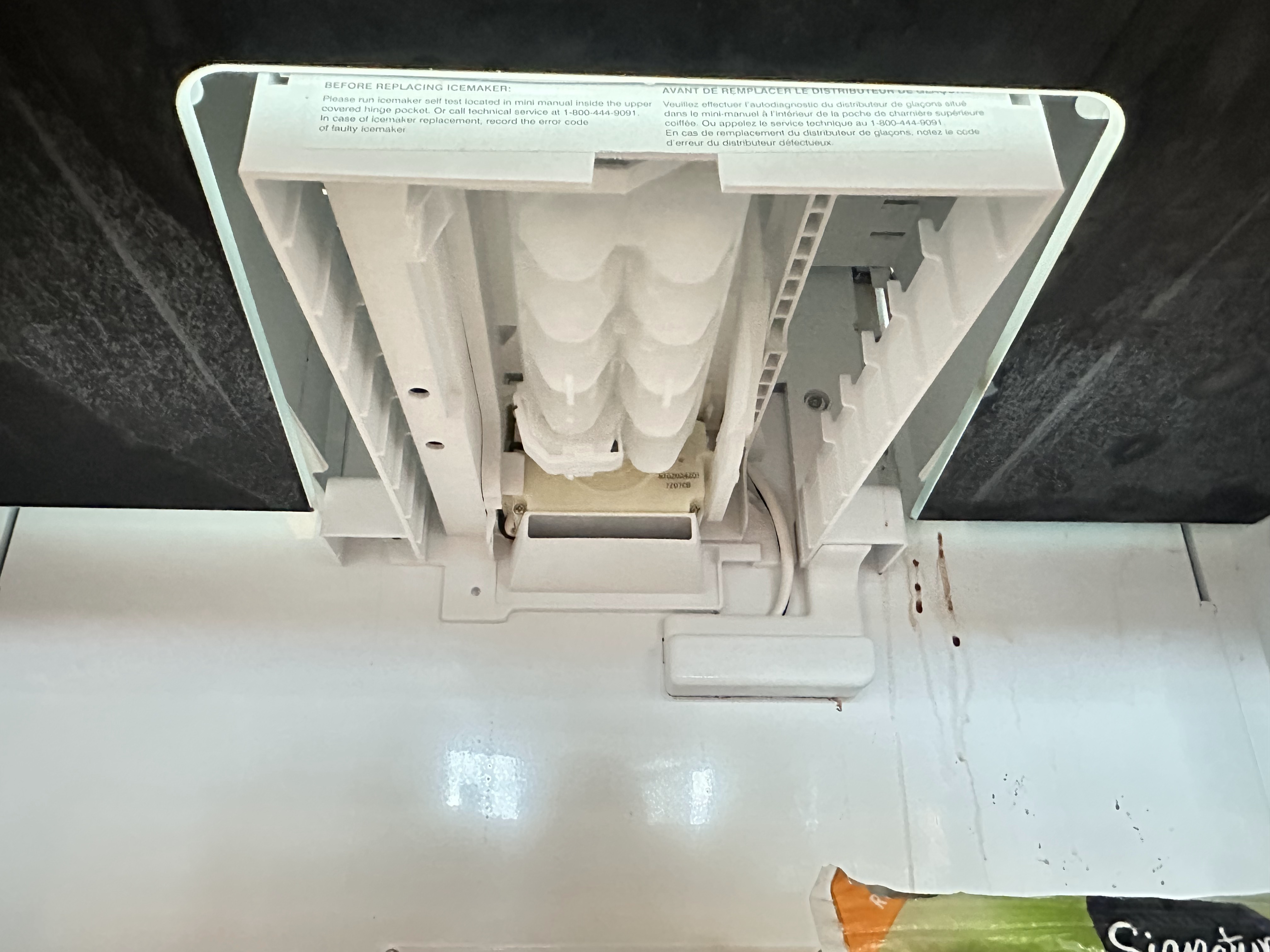 Built-in Thermador refrigerator ice maker producing ice continuously during diagnosis and repair service in Sammamish, WA.