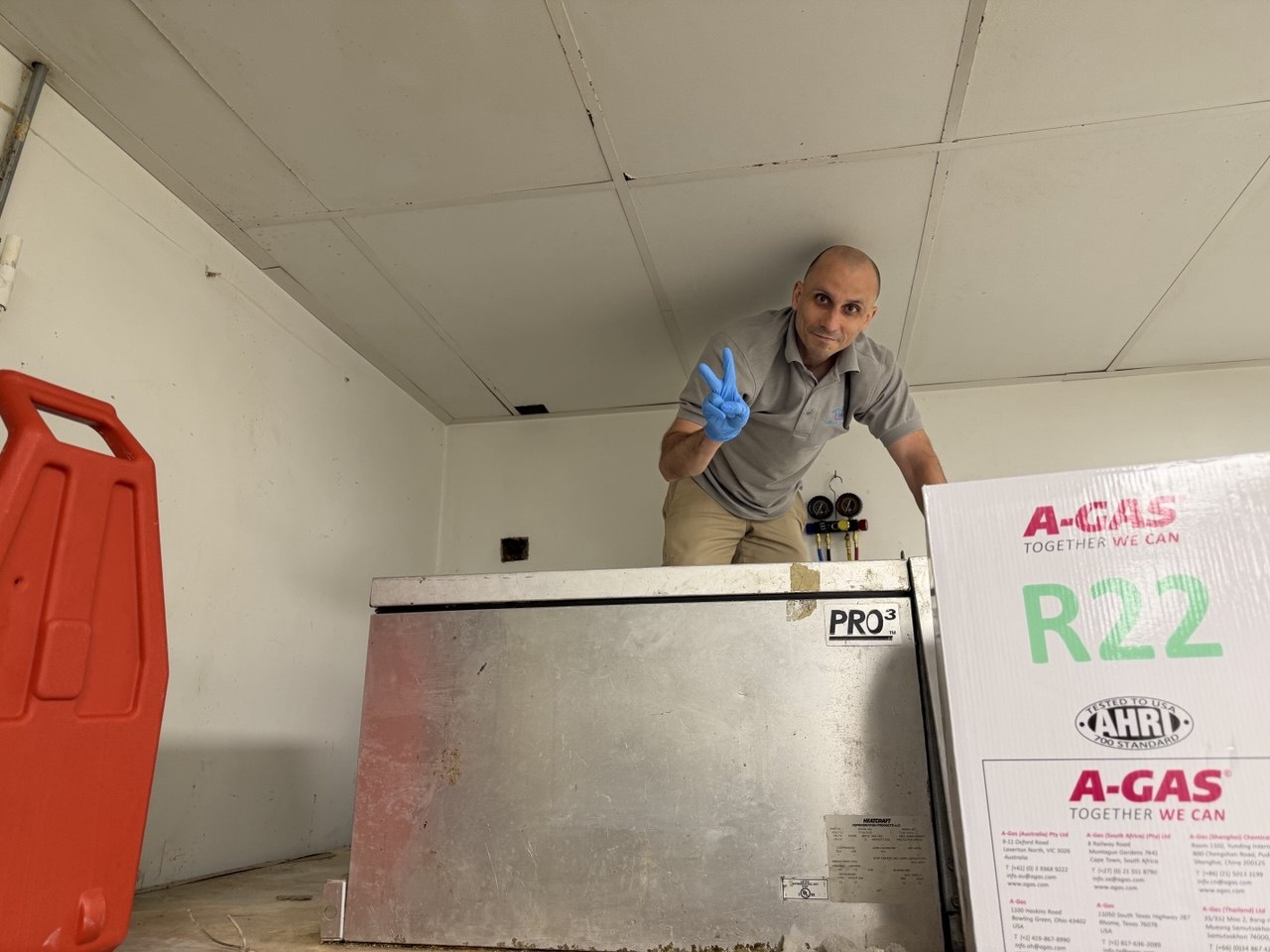 Leonid Rysikov, founder of Up-liance Appliance Repair, working on commercial refrigeration equipment