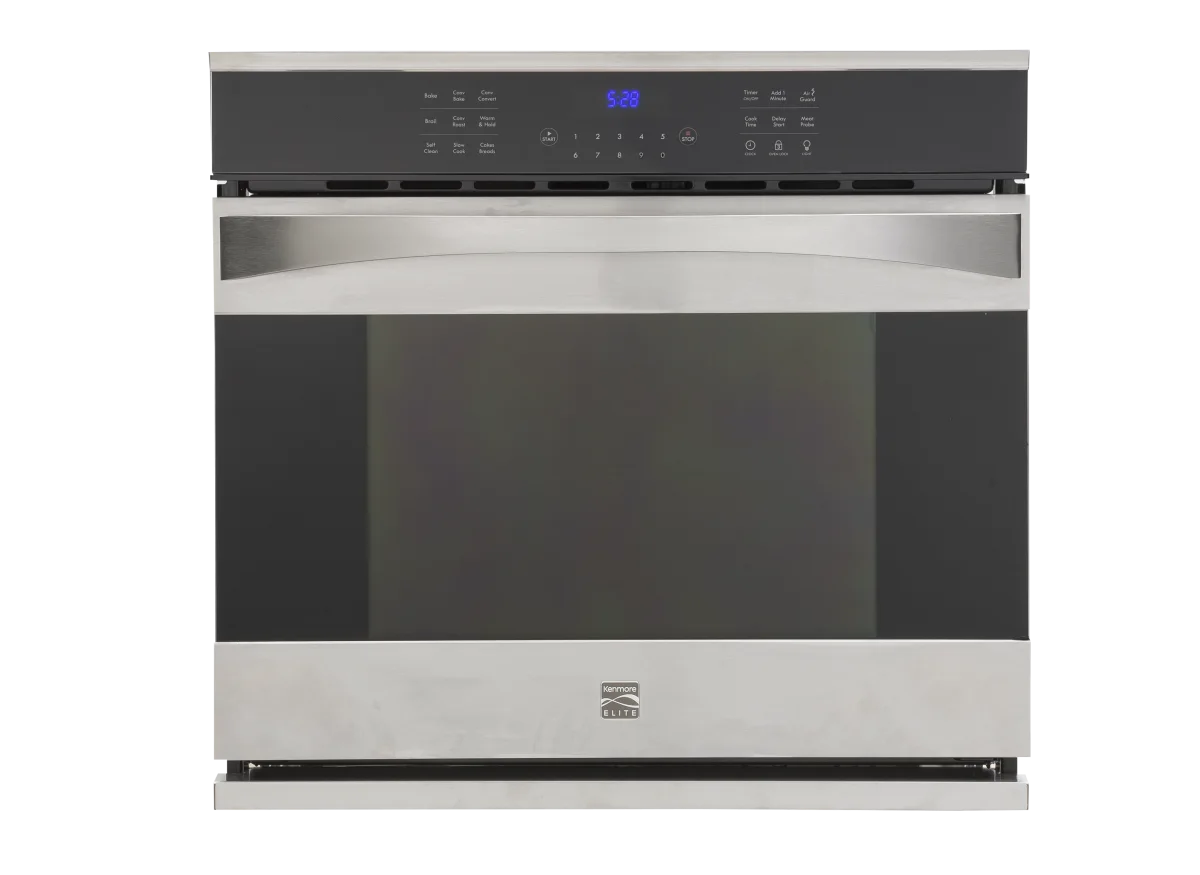 Built-in Kenmore stainless steel wall oven seamlessly installed in contemporary kitchen cabinets